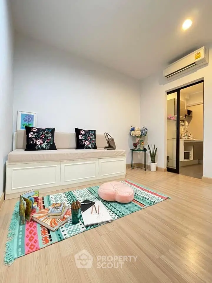 Charming living room with cozy seating and vibrant decor, perfect for relaxation and entertaining.