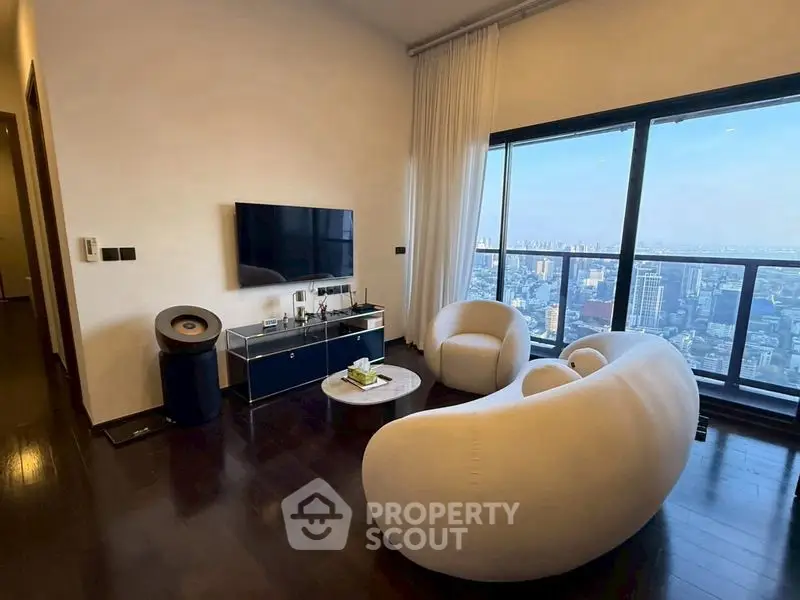 Luxurious living room with stunning city view, modern furniture, and floor-to-ceiling windows.