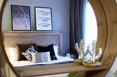 Stylish bedroom with modern decor and unique wall art, featuring a cozy bed and elegant lighting.