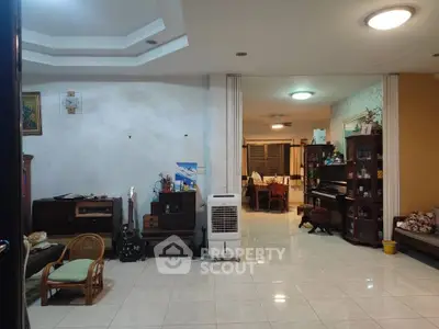 Spacious living room with elegant decor and open layout, perfect for family gatherings.