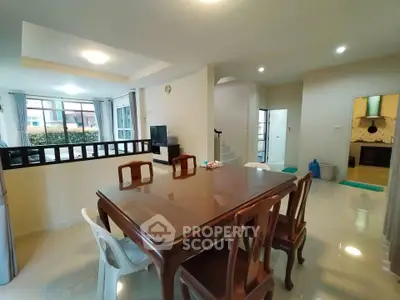 Spacious dining area with elegant wooden table and bright natural lighting