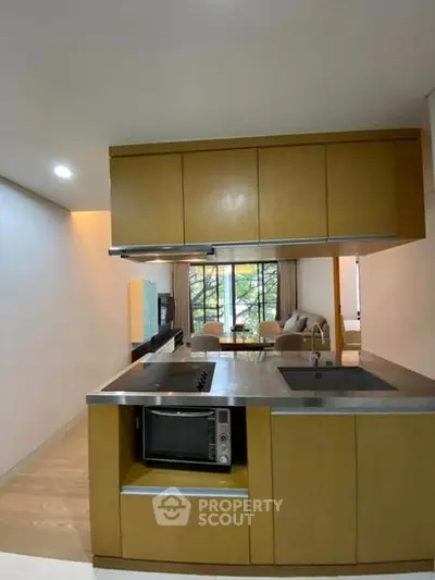 Modern kitchen with open layout and sleek appliances in a stylish apartment