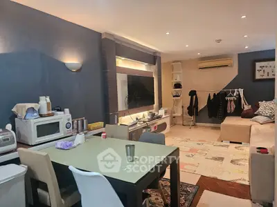 Cozy living room with dining area and modern amenities