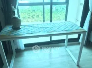 Bright room with modern table and large window view