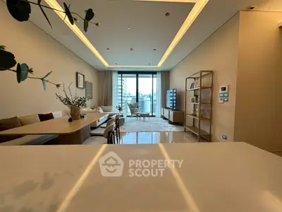 Spacious modern living room with elegant decor and city view balcony