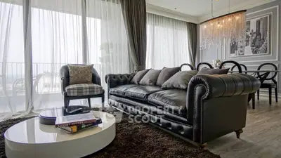Luxurious living room with elegant leather sofa and chic dining area