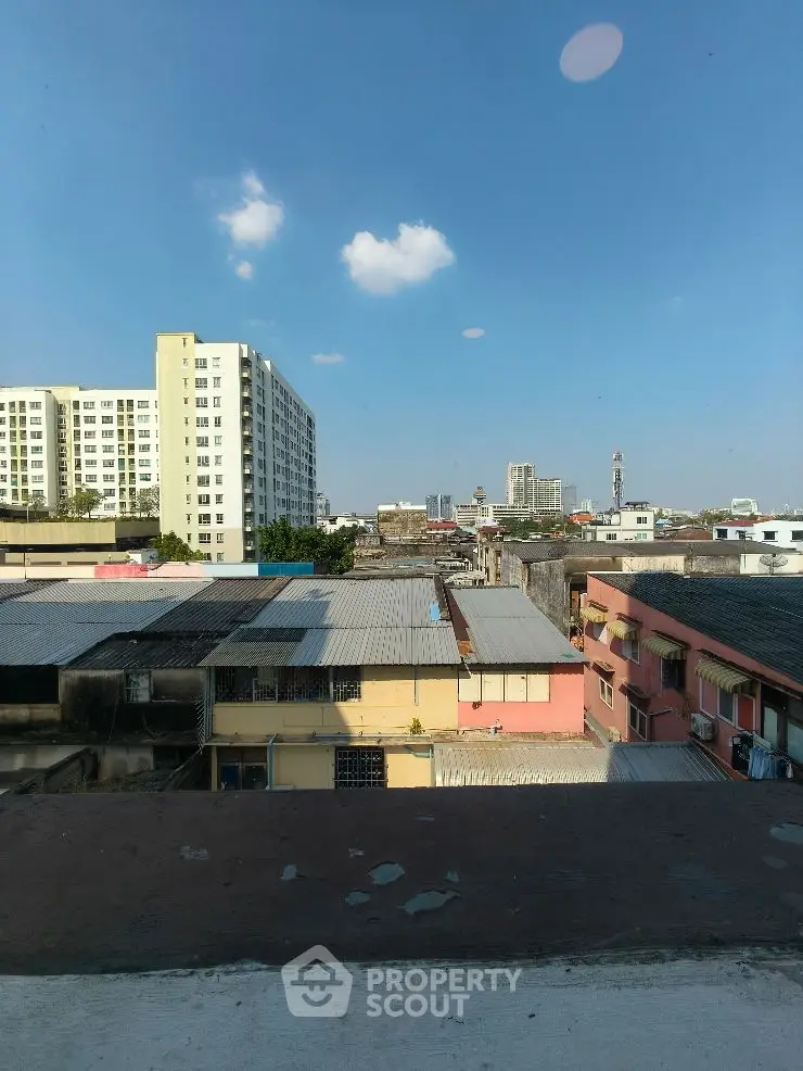 Modern architectural building with unique design against a clear blue sky.