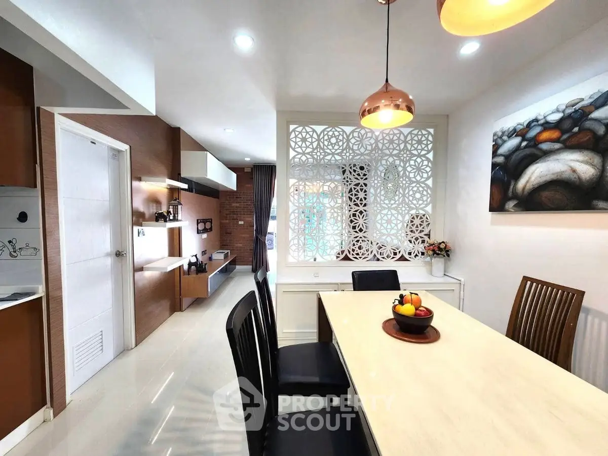 Modern dining area with elegant decor and stylish lighting