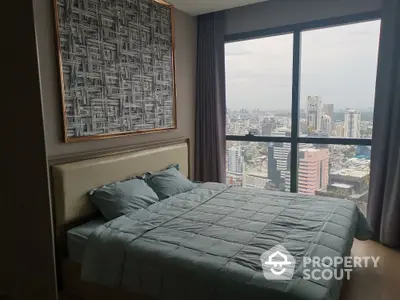 Luxurious bedroom with stunning city view from high-rise apartment window