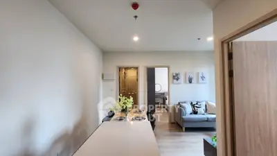 Modern open-plan living room with dining area and cozy seating