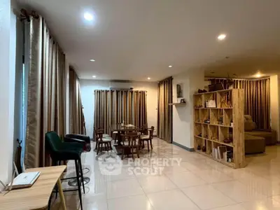 Spacious living room with elegant decor and ample natural light