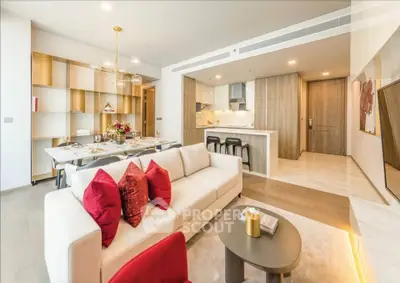 Luxurious open-plan living room with modern kitchen and elegant dining area, featuring stylish decor and ample natural light.