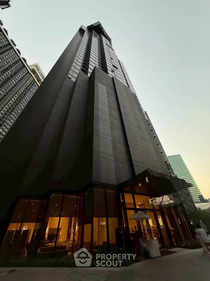 Stunning modern skyscraper with sleek design and glass facade in urban setting.