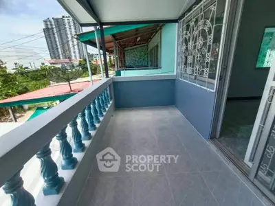 Spacious balcony with city view in modern apartment building