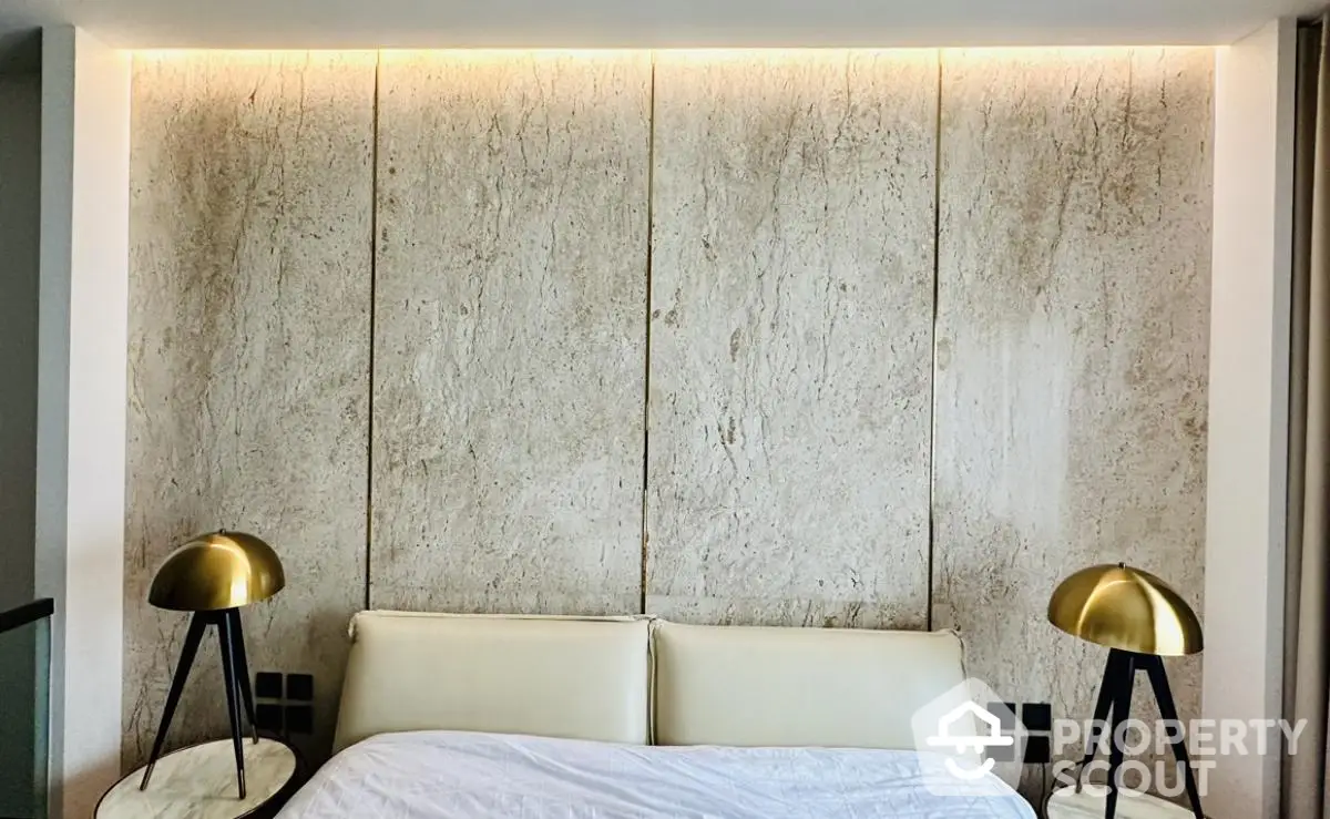 Modern bedroom with stylish lighting and textured wall panels