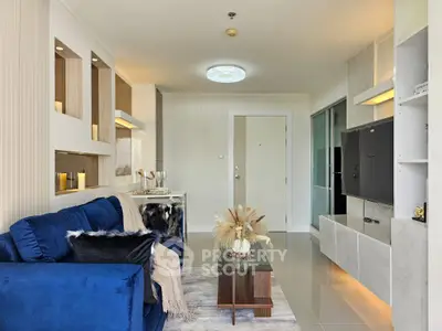 Modern living room with blue sofa and stylish decor