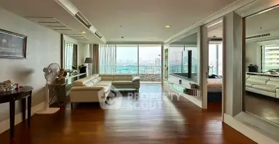 Spacious modern living room with panoramic city view and elegant decor