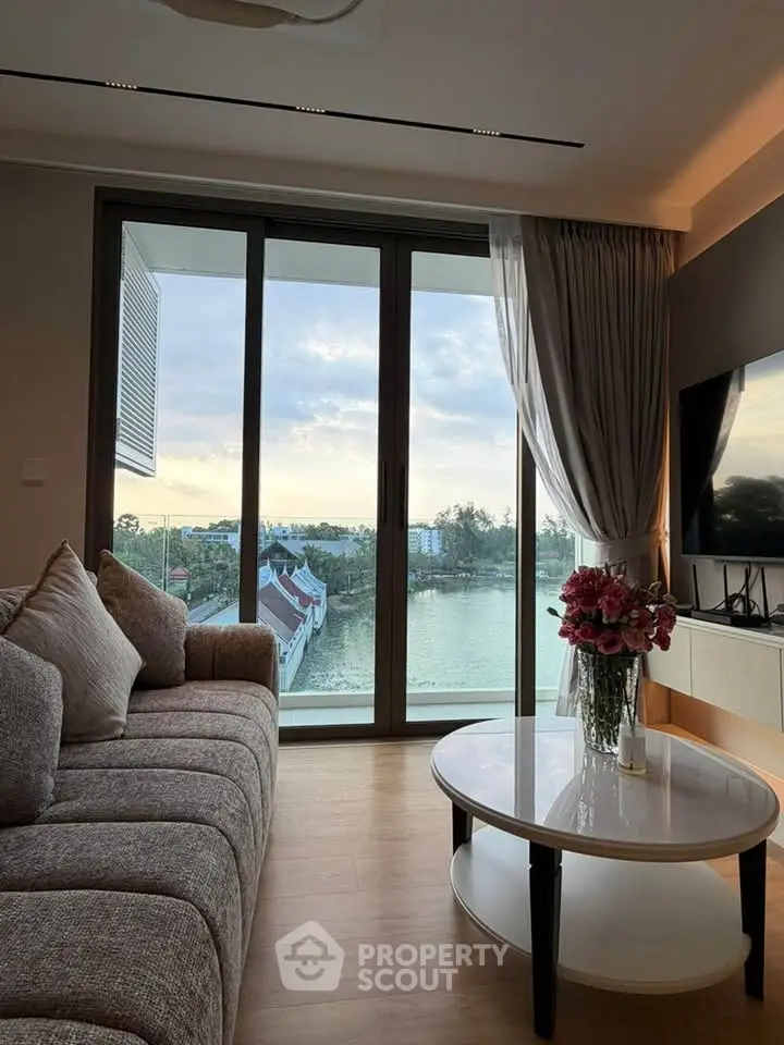Luxurious living room with stunning river view and elegant decor