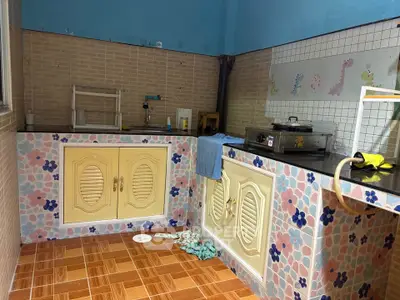 Charming kitchen with colorful tile design and ample counter space