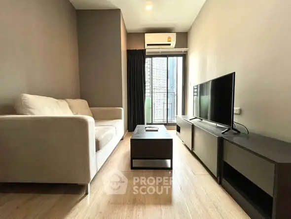 Modern living room with sleek furniture and city view balcony