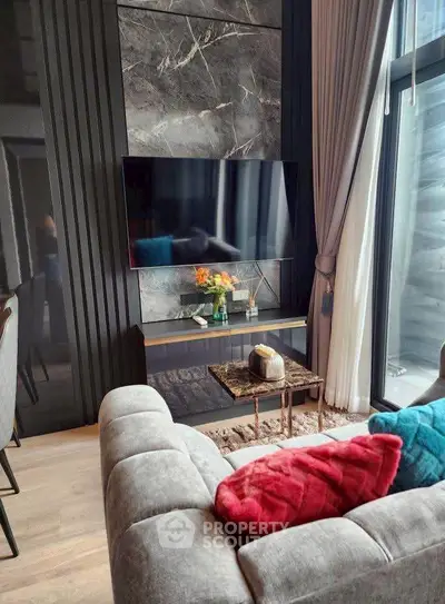 Modern living room with stylish decor and large window