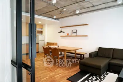Modern open-plan living room with dining area and stylish decor