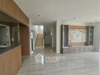 Spacious modern living room with elegant marble accents and open layout