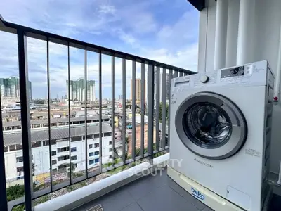 Modern balcony with city view and washing machine, perfect for urban living.