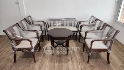 Elegant wooden furniture set in a bright living room with natural light.