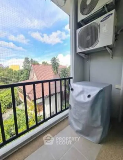 Charming balcony with air conditioning unit and scenic view, perfect for relaxation.