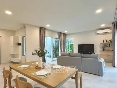 Modern living room with large windows and stylish decor