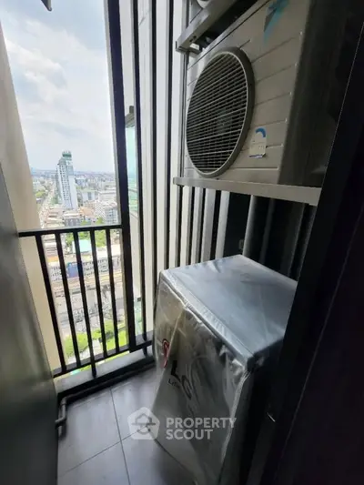 High-rise balcony with city view and air conditioning unit, perfect for urban living.