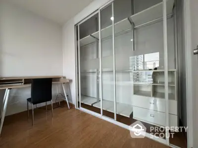 Modern study room with sleek desk and built-in storage in urban apartment