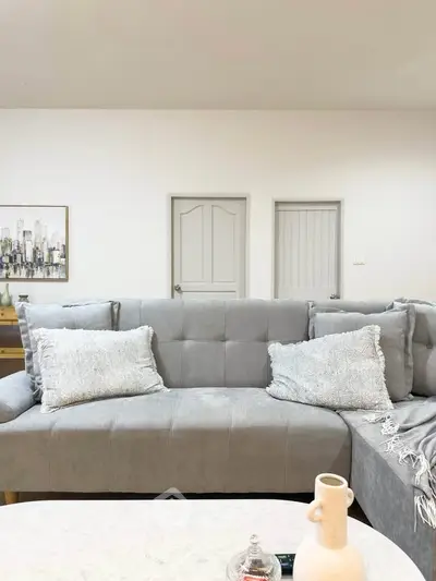 Modern living room with stylish gray sofa and elegant decor