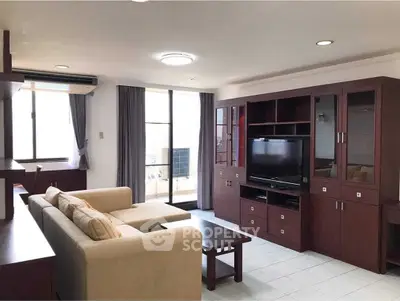 Spacious living room with elegant wooden furniture and natural light