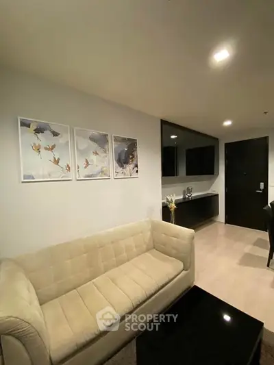 Modern living room with elegant decor and cozy beige sofa