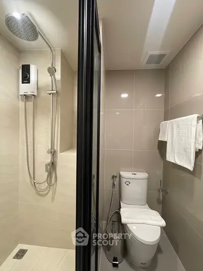 Modern bathroom with shower and toilet in sleek design