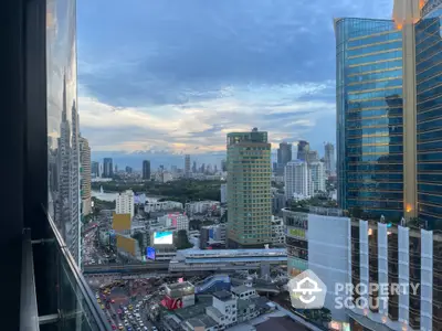 Stunning cityscape view from high-rise building with modern architecture and bustling streets.