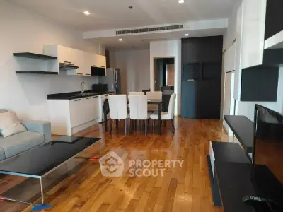 Spacious modern living room with open kitchen and hardwood floors