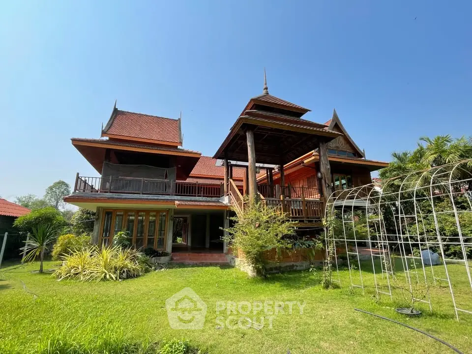 Stunning traditional-style house with lush garden and unique architectural design.