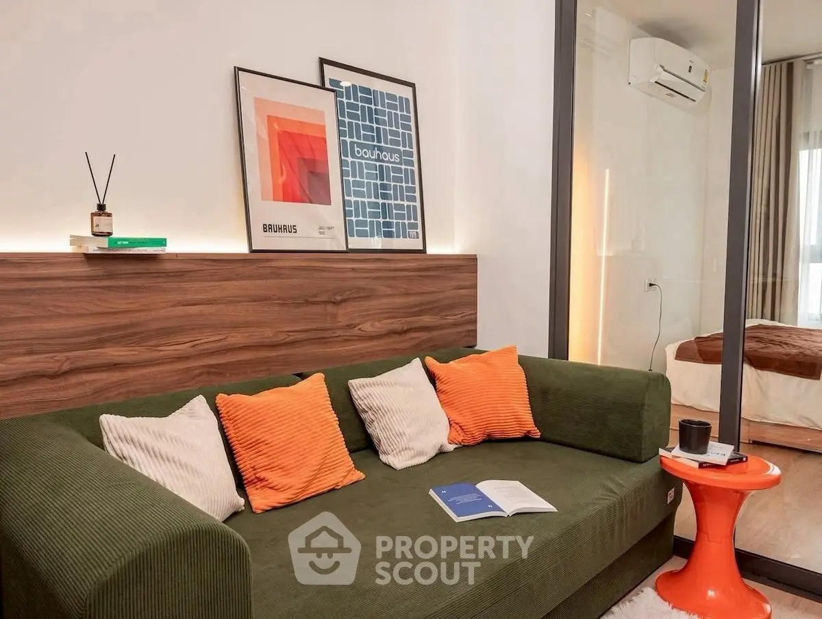 Stylish living room with modern decor and cozy green sofa