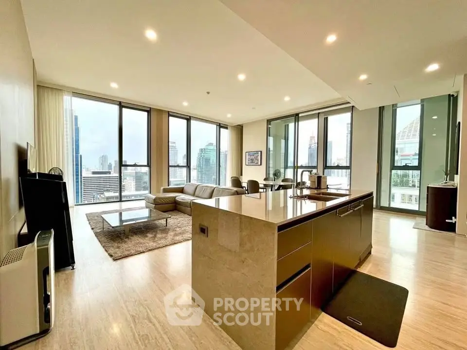 Luxurious open-plan living room with stunning city views and modern furnishings.