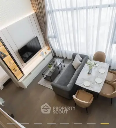 Luxurious modern living room with high ceilings and elegant dining area