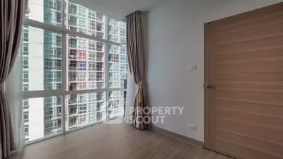 Spacious corner unit with floor-to-ceiling windows and modern design