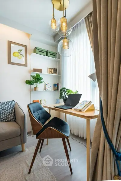 Chic study area with modern desk, cozy chair, and natural light