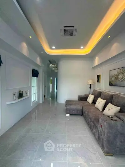Luxurious modern living room with elegant lighting and plush sectional sofa