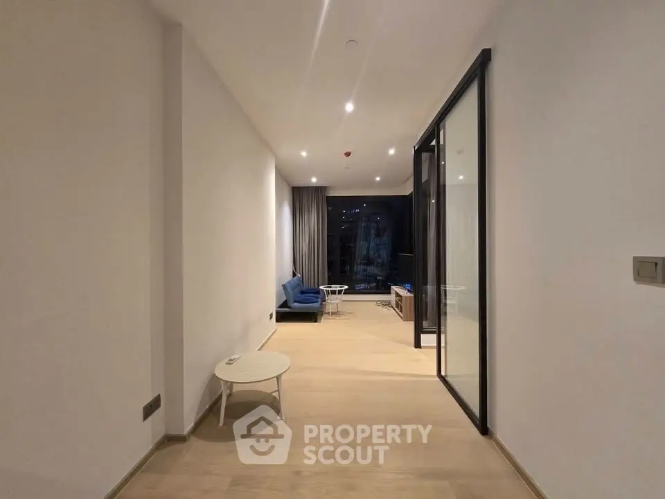 Spacious modern living room with open layout and large windows for natural light.