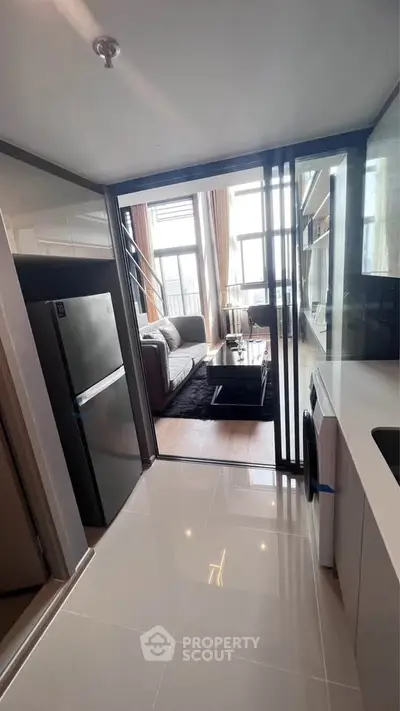 Modern apartment with sleek kitchen and spacious living area