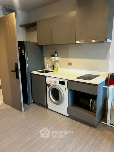 Modern kitchen with integrated appliances and sleek cabinetry
