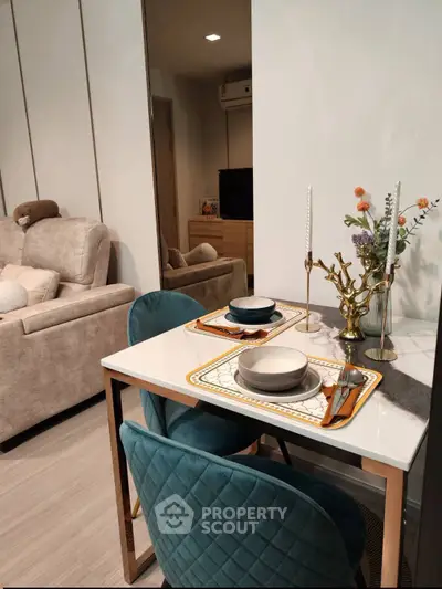 Stylish modern living room with elegant dining area and plush seating